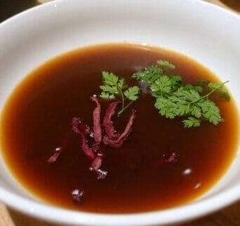 BOLD BITES: Mushroom Consommé with Beet Strips and Chervil